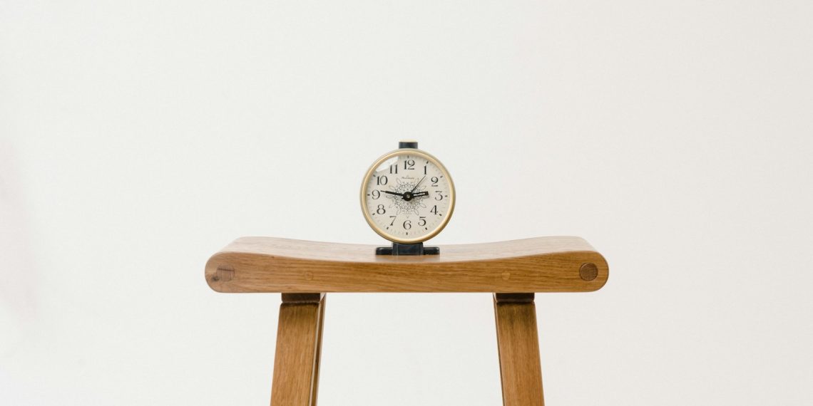 brown wooden table clock at 10 10