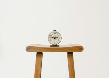 brown wooden table clock at 10 10